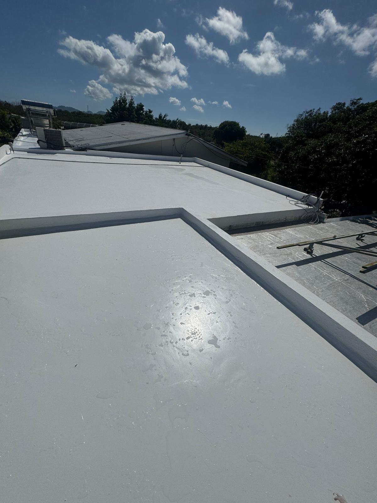 Finished reflective white roof coating on a residential property in Anguilla